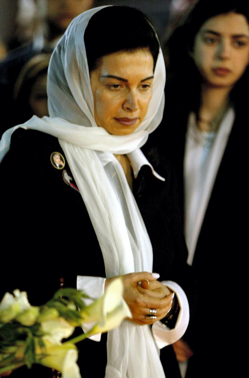 Nazek Hariri, the widow of slain former premier Rafiq Hariri, prays at her husband's grave in Beirut 22 March 2005. Hariri's children have left Lebanon last week due to "security concerns", according to sources close to the family. Hariri, who was killed by a huge explosion in Beirut on February 14, had five children, including a son who lives in Saudi Arabia and another in France. His wife Nazek and sister Bahia, who is an MP, have remained in Lebanon. AFP PHOTO/RAMZI HAIDAR (Photo by RAMZI HAIDAR / AFP)