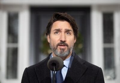 Canadian Prime Minister Justin Trudeau speaks at a bi-weekly news conference outside Rideau cottage on the COVID-19 pandemic in Ottawa, Ontario, Friday, Nov. 27, 2020. (Adrian Wyld/The Canadian Press via AP)