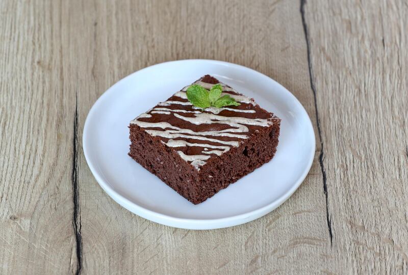 Dubai, United Arab Emirates - May 14, 2019: Iftar Signature Dish. Tahini Brownie from Kcal. Tuesday the 14th of May 2019. Healthcare City, Dubai. Chris Whiteoak / The National

Chefs description: Classic Kcal brownie made with zero sugar or flour but with an Arabic twist drizzled in sweet tahini sauce. Our limited edition Tahini Brownie is made with zero sugar or flour and only uses natural ingredients. The tahini (toasted ground hulled sesame) is found in the mixture along with a sweetened drizzle on top.