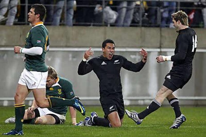 New Zealand's Mils Muliana celebrates after touching down against South Africa at Westpac Stadium.