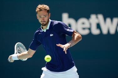 Daniil Medvedev, of Russia, returns a shot from Andy Murray, of Britain, during the Miami Open tennis tournament, Saturday, March 26, 2022, in Miami Gardens, Fla.  (AP Photo / Wilfredo Lee)