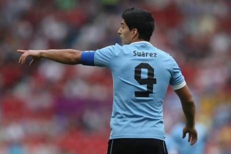 Luis Suarez, who has been kept busy of late playing for Uruguay's national team, says he will not force a move from Liverpool.