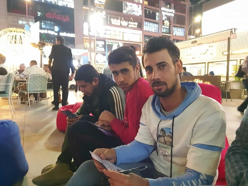 Construction worker Abbas Salam, 16, says he cannot afford to pay for encrypted channels to watch the matches so he enjoys the games at the fan zone