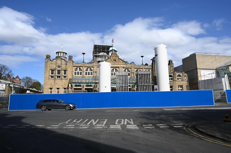Large liquid oxygen tanks are seen installed at the rear of the Nightingale Hospital Yorkshire and the Humber set up at the Harrogate Convention Centre in Harrogate, northern England to help with the new coronavirus covid-19 outbreak. AFP