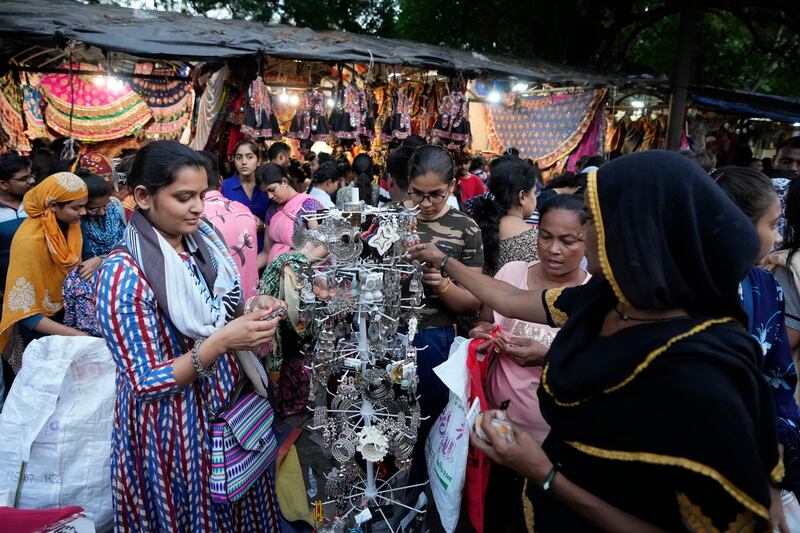 People throng a market ahead of Navratri in Ahmedabad, India. AP