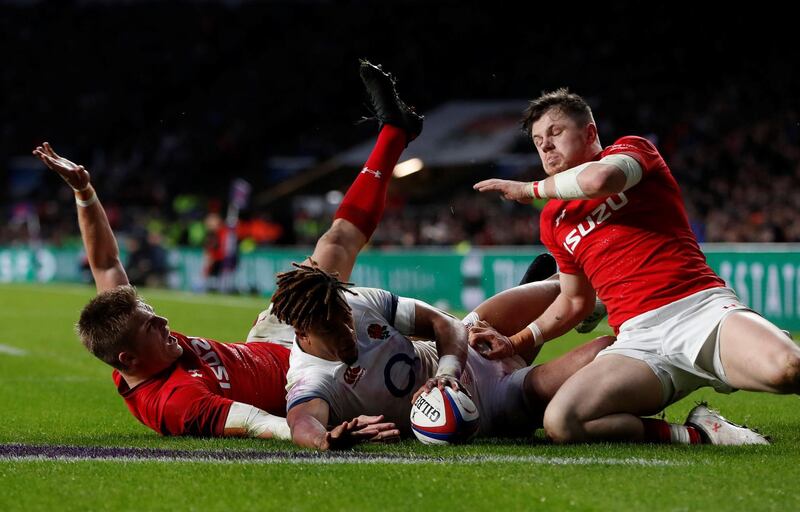 Rugby Union - Six Nations Championship - England vs Wales - Twickenham Stadium, London, Britain - February 10, 2018   England’s Anthony Watson in action with Wales’ Gareth Anscombe before a try is disallowed for Wales     Action Images via Reuters/Paul Childs