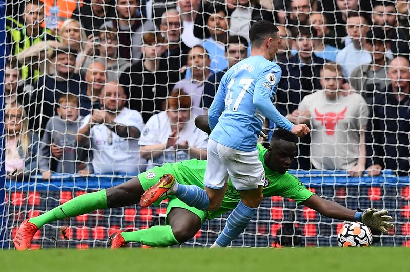 Chelsea goalkeeper Edouard Mendy saves from Manchester City's Phil Foden. AFP
