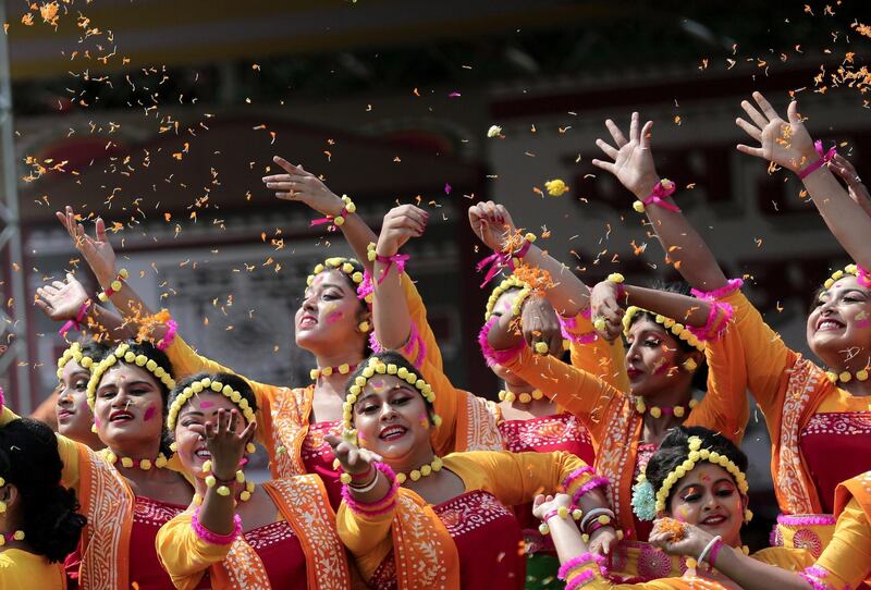 Indian students perform a dance to a Tagore song as they celebrate the Holi festival at Tagore University in Kolkata, eastern India. The Rabindra Bharati University organized the festival of colors at their campus. Holi is an ancient Indian festival to mark the arrival of spring.  EPA