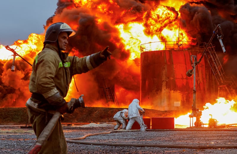Firefighters work to extinguish a blaze after shelling at an oil terminal in the town of Shakhtarsk near Donetsk, in the Russian-controlled region of Ukraine. Reuters