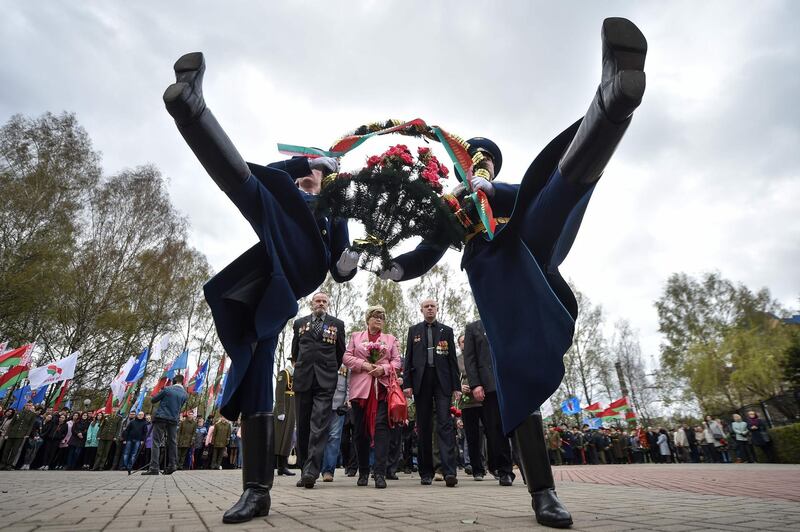 Honour guard soldiers lay flowers at the Chernobyl victims' memorial in Minsk. Sergei Gapon / AFP Photo