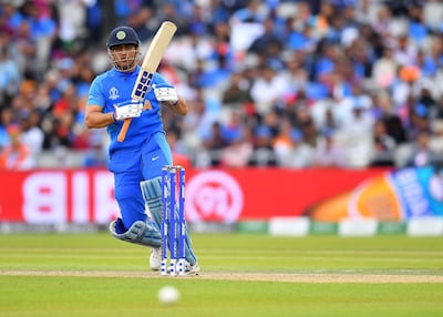 MANCHESTER, ENGLAND - JULY 10:  MS Dhoni of India in action batting  during the Semi-Final match of the ICC Cricket World Cup 2019 between India and New Zealand at Old Trafford on July 10, 2019 in Manchester, England. (Photo by Clive Mason/Getty Images)