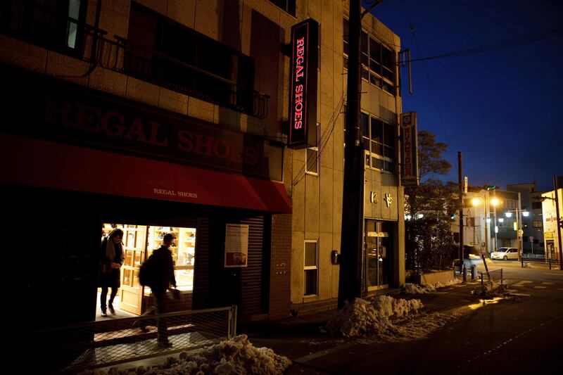 Lights are up at at Regal Shoes, owned by Kenji Masaoka, 63, in Ishinomaki in Miyagi prefecture, Japan on Feb 28, 2012 as he prepares for the shop's reopening on March 2. Masaoka's two shoe shops were flooded with mud and heavily damaged by the massive tsunami hit northern Japan on March 11, 2011.
Photo by Kuni Takahashi