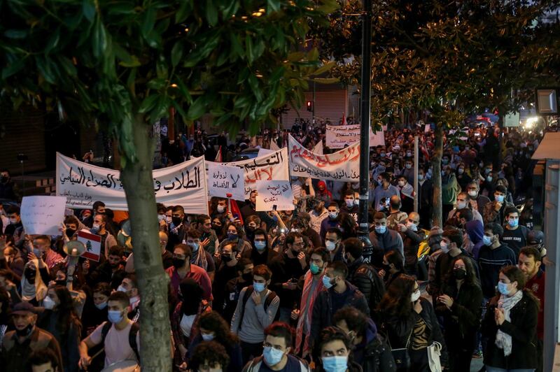 Students from different universities carry placards, wave Lebanese flags during a demonstration under the slogan of 'A Day of Student Rage' in Al-Hamra, Beirut. EPA