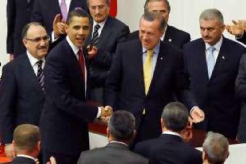 U.S. President Barack Obama (L) shakes hands with Turkey's Prime Minister Recep Tayyip Erdogan (R) after Obama addressed Turkey's Parliament in Ankara, Turkey, April 6, 2009. Obama's visit on the last leg of an eight-day trip that marks his debut as president on the world stage, is a recognition of the secular but predominantly Muslim country's growing clout and Washington's desire for its help to solve confrontations and conflicts from Iran to Afghanistan.    REUTERS/Jason Reed    (TURKEY POLITICS)
