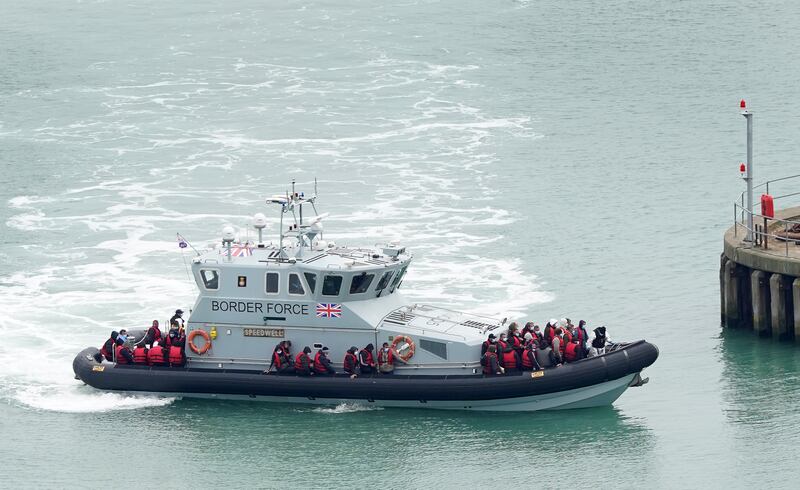Migrants are taken into Dover, Kent, on a Border Force vessel, after a small boat incident in the English Channel, on May 2. PA