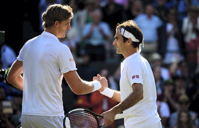 LONDON, ENGLAND - JULY 11: Kevin Anderson of South Africa shakes hands after beating Roger Federer of Switzerland in the gentlemen's quarter finals at the All England Lawn Tennis and Croquet Club on July 11, 2018 in London, England. (Photo by TPN/Getty Images)