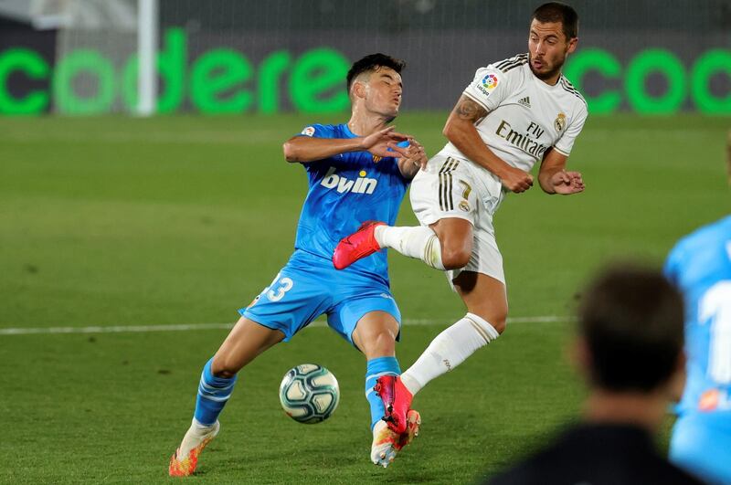 Real Madrid's forward Eden Hazard tackles Valencia's Hugo Guillamon. EPA