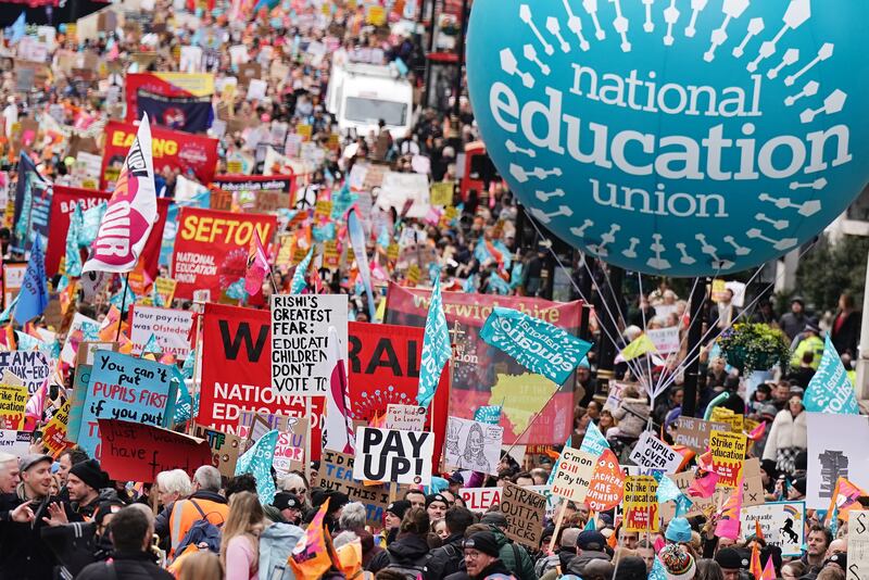 Striking teachers from the National Education Union march to a rally in Trafalgar Square, central London. PA