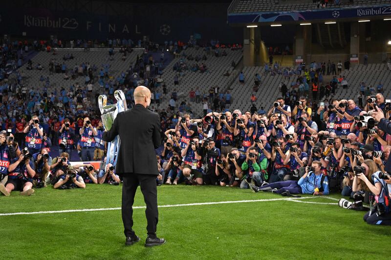 Manchester City's Spanish manager Pep Guardiola poses for a picture with the European Cup trophy after winning the UEFA Champions League final football match between Inter Milan and Manchester City at the Ataturk Olympic Stadium in Istanbul. AFP