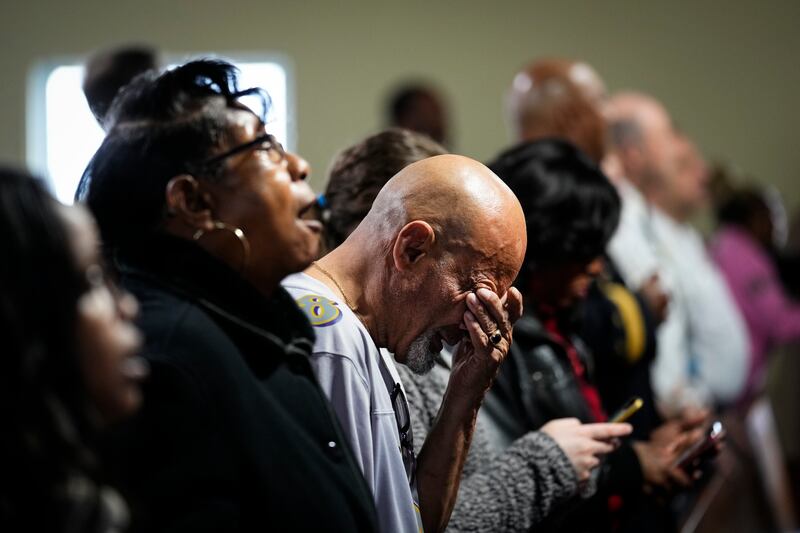 People gather for a vigil near the scene where a container ship collided with a support column on the Francis Scott Key Bridge, at Mount Olive Baptist Church in Dundalk, Maryland. AP