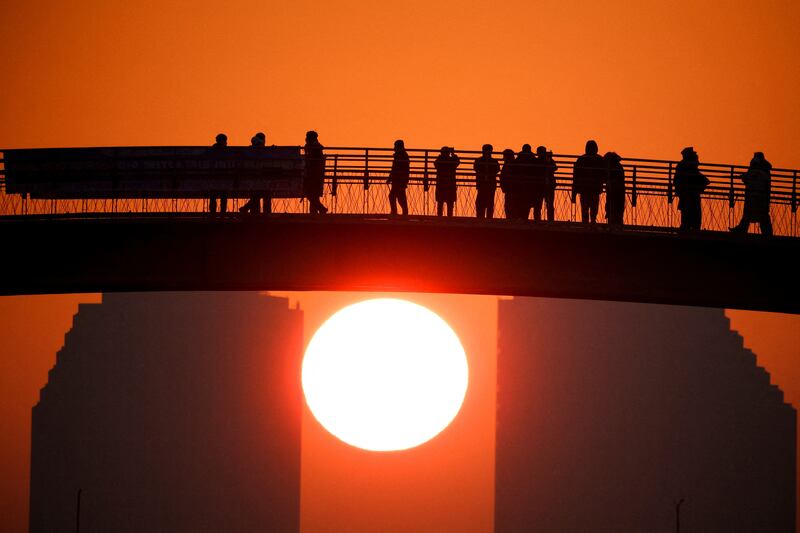 The first sunrise of the year is seen at a park in Seoul, South Korea. Reuters