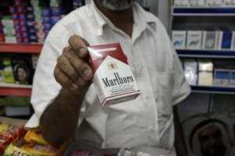 United Arab Emirates - Abu Dhabi - Jan 06 - 2010 : A seller show a Malboro Cigarette pack in a shop. ( Jaime Puebla / The National ) *** Local Caption ***  JP Smoking 04c.jpg