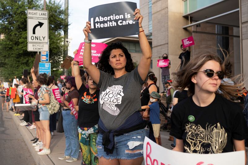 Women protest outside a courthouse in Tucson. Reuters