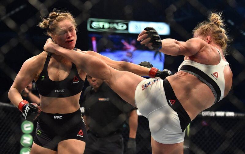 Ronda Rousey, right, and Holly Holm compete in their UFC women's bantamweight championship bout during the UFC 193 event at Etihad Stadium on November 15, 2015 in Melbourne, Australia. (Photo by Quinn Rooney/Getty Images)