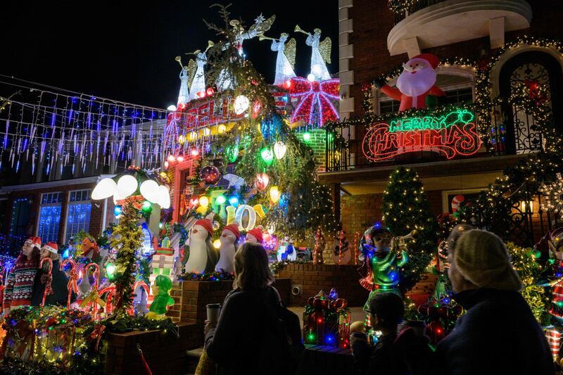 People from all over come to walk the streets of Dyker Heights to take in the holiday lights. AFP