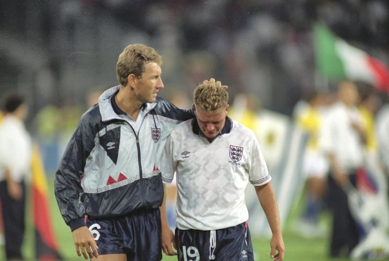 Terry Butcher (left) of England consoles team mate Paul Gascoigne after the World Cup semi-final against West Germany at the Delle Alpi Stadium in Turin, Italy. Allsport UK