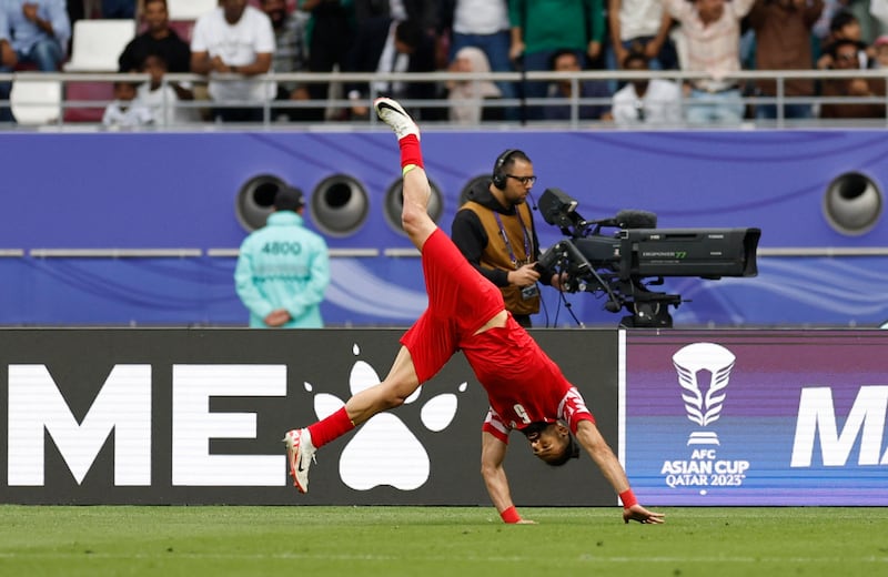 Jordan's Yazan Al Arab celebrates scoring their second to equalise late in the game. Reuters