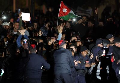 Jordanians clash with riot police in Amman as they protest against the government's decision to raise taxes. AFP