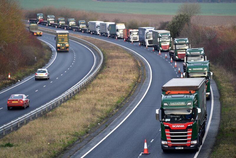 epa07267320 Lorries are seen queuing in the A259 road during a test drive to the Port of Dover during a trial of how roads will cope in case of a no-deal Brexit in Kent, Britain, 07 January 2019. Hauliers fear a no-deal Brexit will create additional border checks, leading to queues of up to 29 miles. The government said it had to 'prepare for all eventualities'.  EPA/NEIL HALL