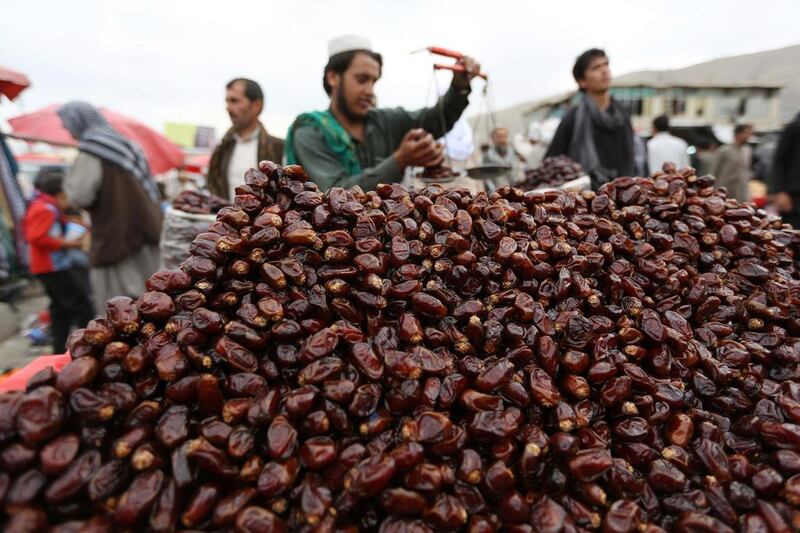 A street vendor sells dates during the Muslim holy month of Ramadan in Kabul, Afghanistan.  Rahmat Gul / AP Photo