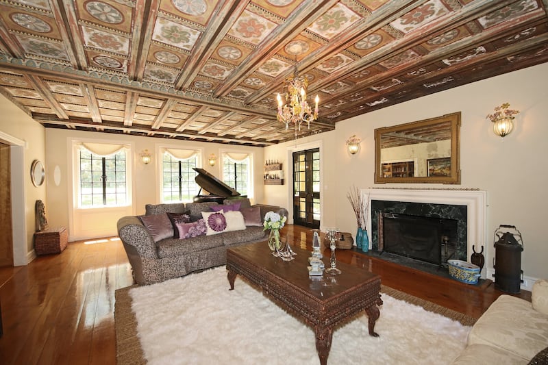 The interiors are brimming with period features, such as this hand-painted coffered ceiling