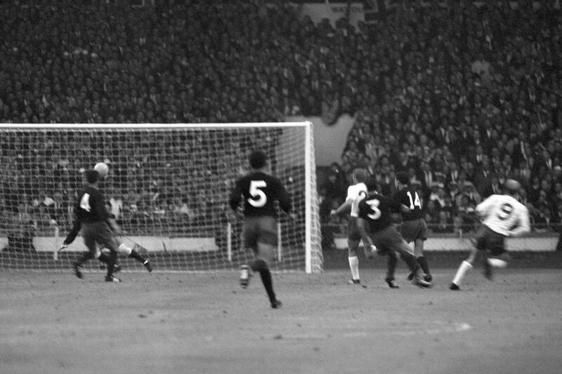 England's Bobby Charlton watches as his shot fly past Mexico goalkeeper Ignacio Calderon during the 1966 World Cup match at Wembley Stadium in London.