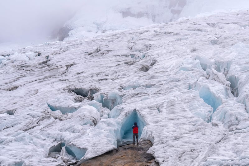 A tourist explores the Ritacuba Blanco glacier at the Guican National Natural Park in Colombia. AFP