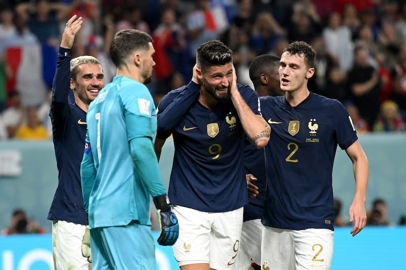 Olivier Giroud of France celebrates with teammates after scoring their fourth goal to equal Thierry Henry's record of 51 goals for his country in the World Cup Group D match against Australia at Al Janoub Stadium on November 22, 2022. Getty