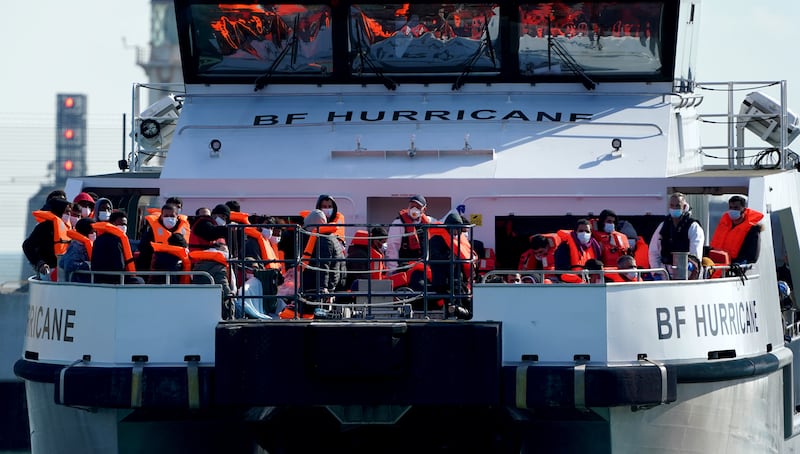 Migrants arrive in Dover, on board a Border Force vessel.