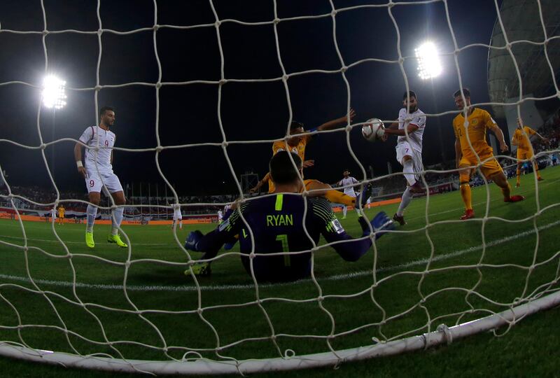 Syria's Omar Khribin, second right, scores his opening goal. AP Photo