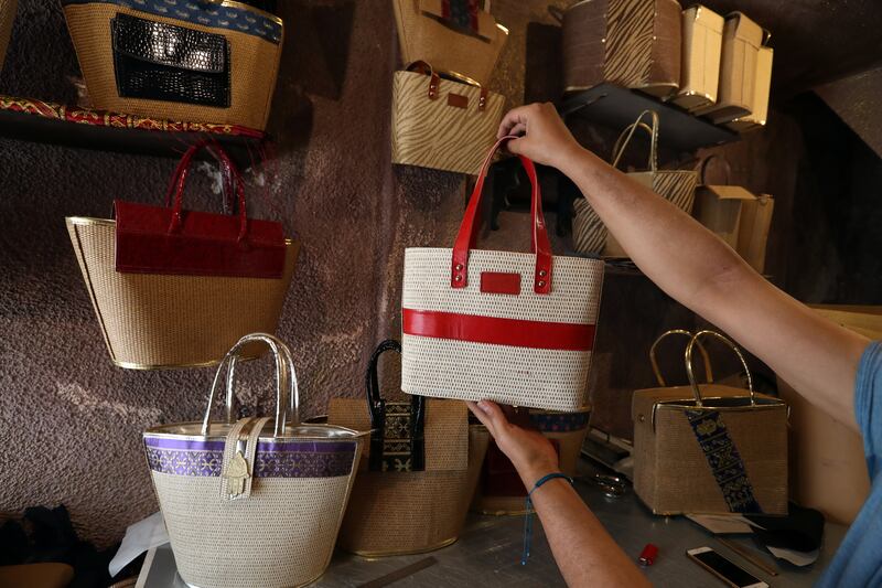 Completed handbags at a workshop in the old town of Tunis, Tunisia. Handbags are very popular with visitors, bringing tourist revenue. The tradespeople and the souqs that sold their goods suffered badly in the coronavirus pandemic.   