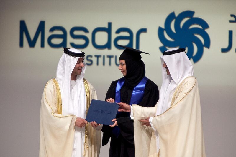 Abu Dhabi, United Arab Emirates, June 11, 2013: 
(L) HH Sheikh Hazza bin Zayed, the National Security Adviser and vice chairman of the Executive Council of Abu Dhabi, hands a diploma to Sheikha al Zaabi, 24, who, accompanied by her father, is graduating with a Master's Degree in Engineering Systems and Management, during the Masdar's 2013 graduation ceremony on Wednesday evening, June 12, 2013 at the Emirates Palace in Abu Dhabi.
Silvia Razgova / The National

 *** Local Caption ***  sr-130612-masdargrad31.jpg