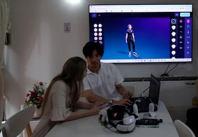 A therapist helps a woman to create an avatar in a virtual therapy psychology treatment centre. EPA