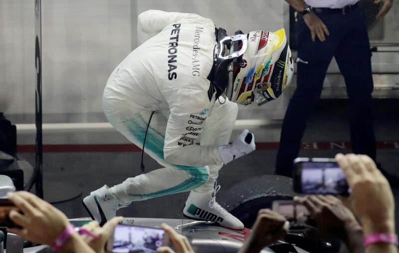 Formula One F1 - Singapore Grand Prix 2017 - Singapore - September 17, 2017   Mercedes' Lewis Hamilton celebrates winning the race   REUTERS/Jeremy Lee     TPX IMAGES OF THE DAY