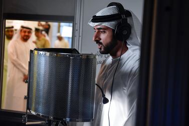 Sheikh Hamdan records a narration to a science lesson for Arabic-speaking children in 2018. The Crown Prince will also take to the airwaves on Emirates' in-flight entertainment. Courtesy: Wam