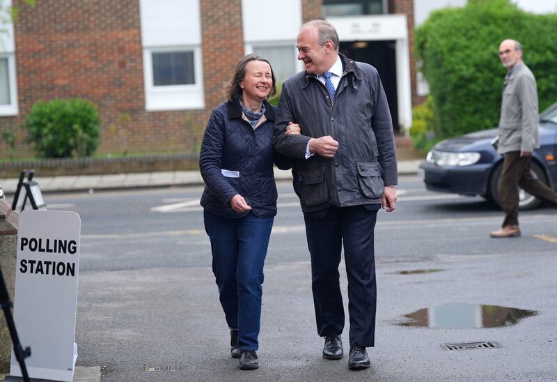 Britain's Liberal Democrat leader Ed Davey and his wife Emily Gasson arrive at a polling station in south-west London. PA