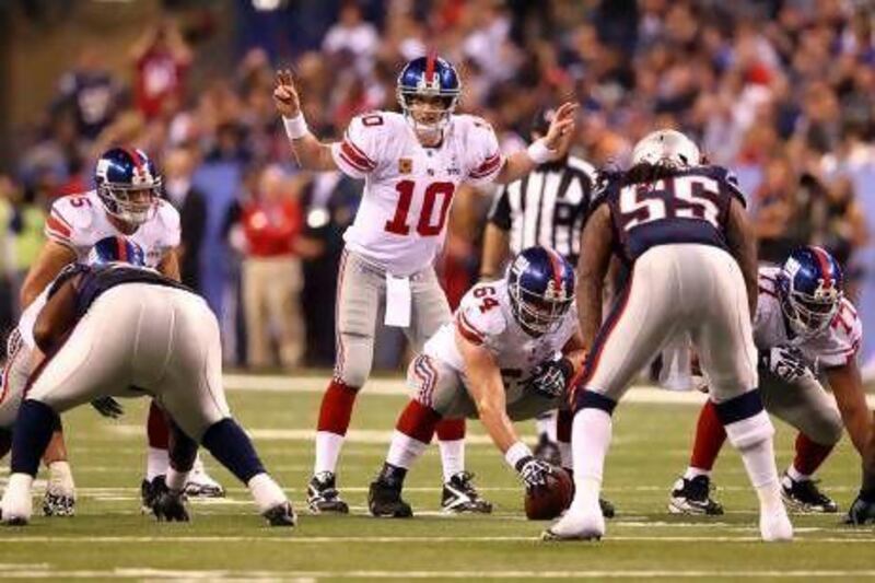 Quarterback Eli Manning, centre, is hoping to get his New York Giants team off to a faster start in the regular season this time around.