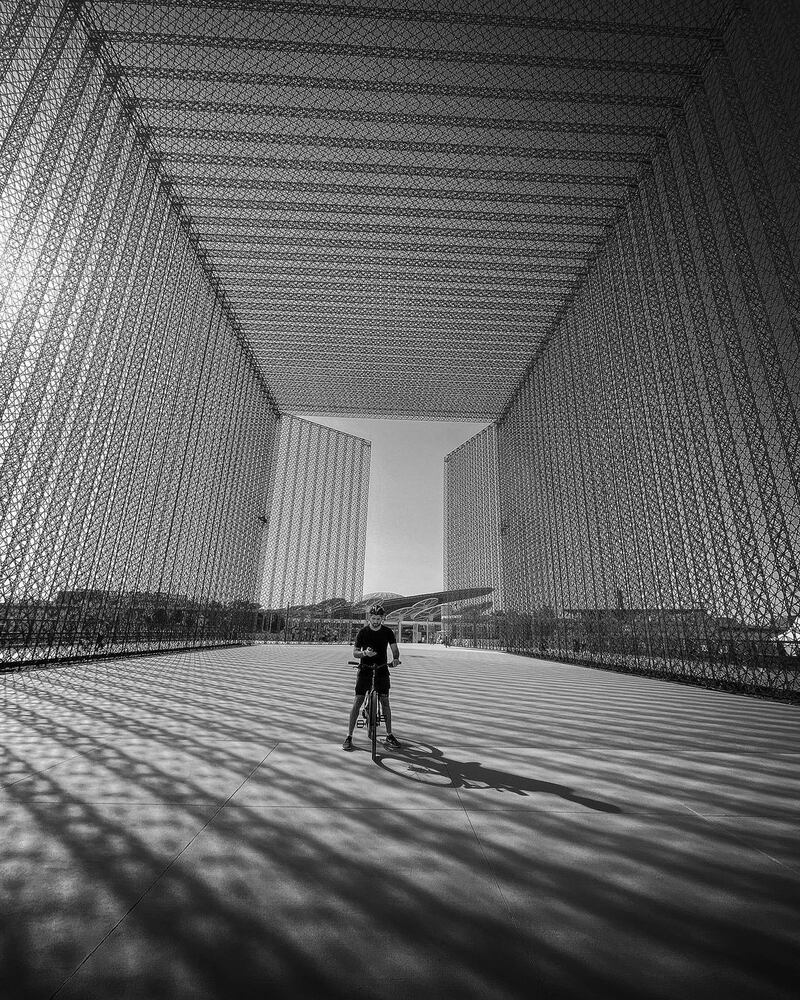 Sheikh Hamdan outside the huge entry gates that will welcome visitors when the world's fair gets under way on October 1, 2021.