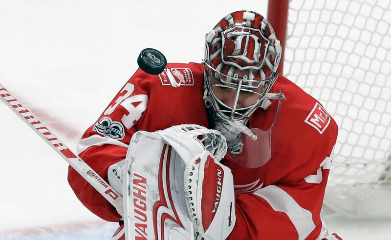 Detroit Red Wings goalie Petr Mrazek deflects the puck during the third period of an NHL hockey game against the Washington Capitals in Detroit. Carlos Osorio / AP Photo