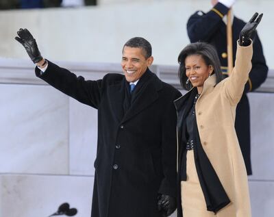 US President-elect Barack Obama and his wife Michelle arrive at the 'We Are One" concert, one of the events of Obama's inauguration celebrations, at the Lincoln Memorial in Washington on January 18, 2009. A galaxy of stars including Bruce Springsteen, U2 and Stevie Wonder will usher Obama into the White House, with a half-million people expected to brave the cold to celebrate the first African-American president.          AFP PHOTO/Jewel SAMAD (Photo by JEWEL SAMAD / AFP)